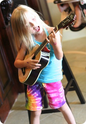 Noelle playing the guitar