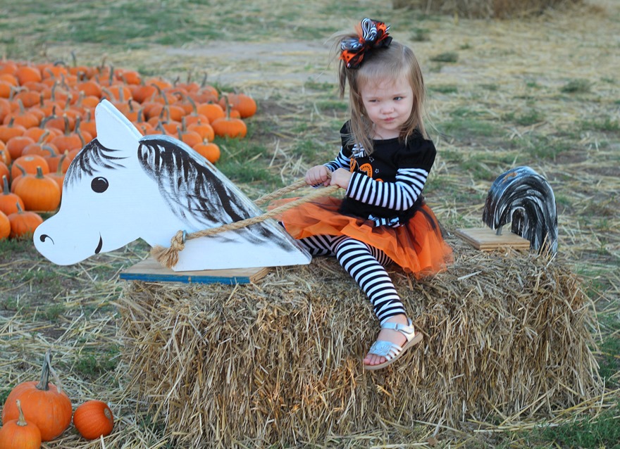 Rose riding the horse horsie at the pumpkin patch age 2 1/2 haha