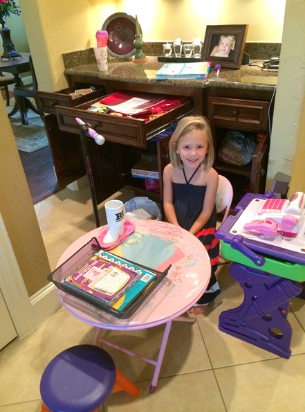 Anna Kate playing shop store setting up shop