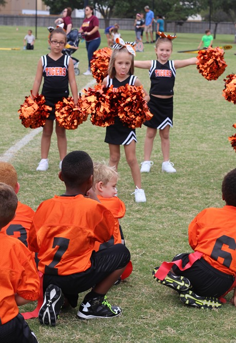 sticking her tongue out at the football players on the first game she said they started it!