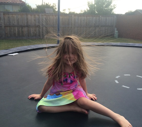 rose and her crazy hair on the trampoline