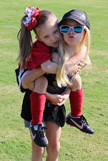 piggy back ride after first game sister tradition
